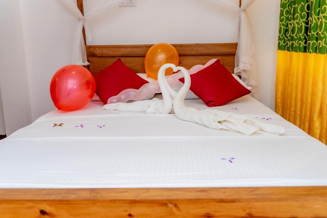 Rainforest Holiday Inn دينيايا المظهر الخارجي الصورة